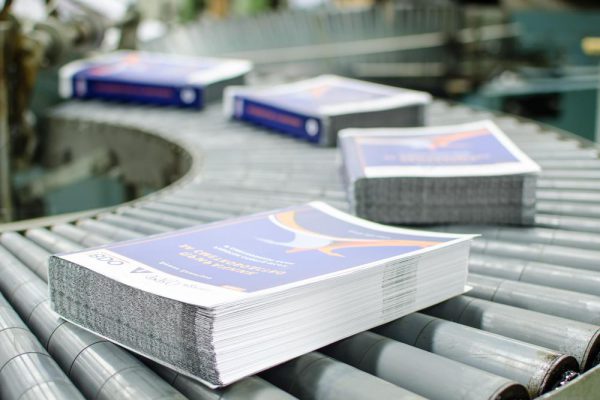 printed-stack-of-papers-on-factory-machine